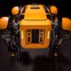 a close up of a robot that is yellow and black